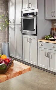 A commercial-style gas range in a bright kitchen setting