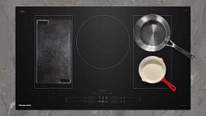 Various pans on an induction cooktop.