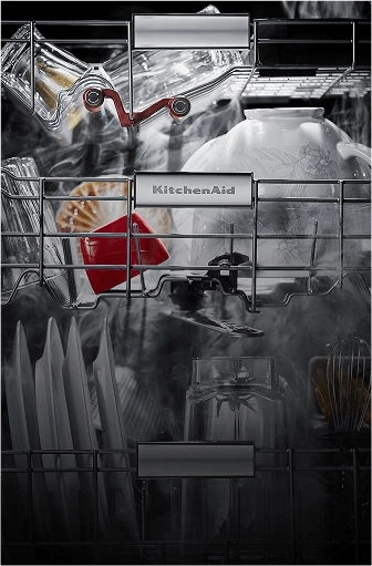 A loaded three rack dishwasher