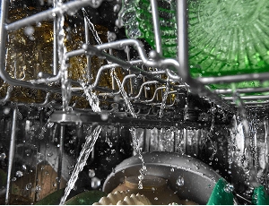 The inside of a dishwasher while its running.