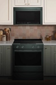 A KitchenAid® Over-the-Range microwave installed above a sleek, slide-in range