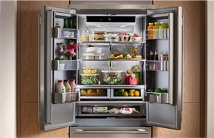 A KitchenAid® French door refrigerator opened to reveal a stunning interior