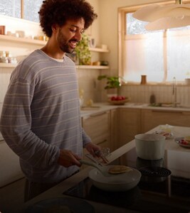 A person making pancakes.
