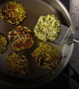 A person making food on a cooktop.