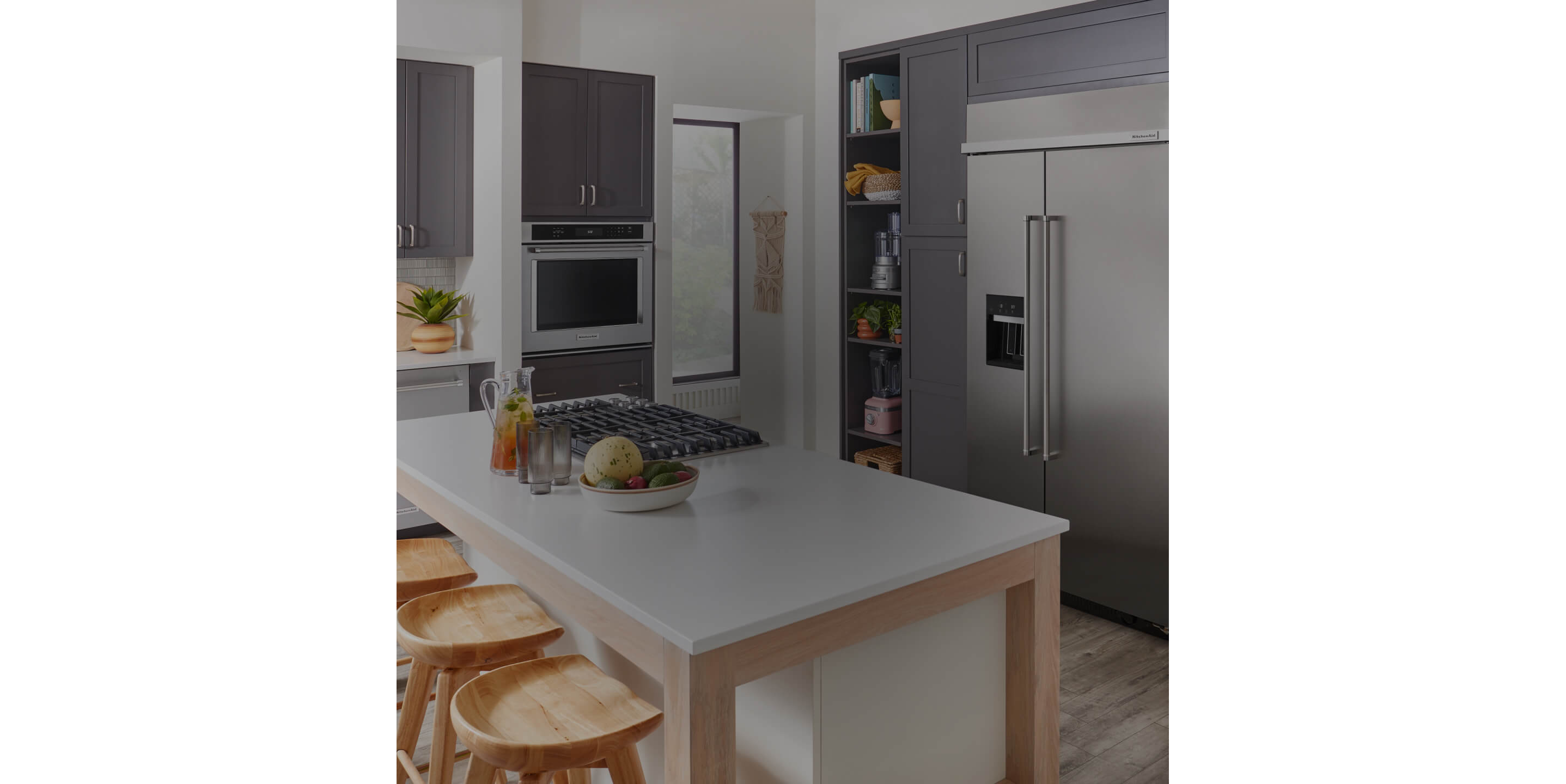 A kitchen outfitted in a complete suite of KitchenAid® appliances.