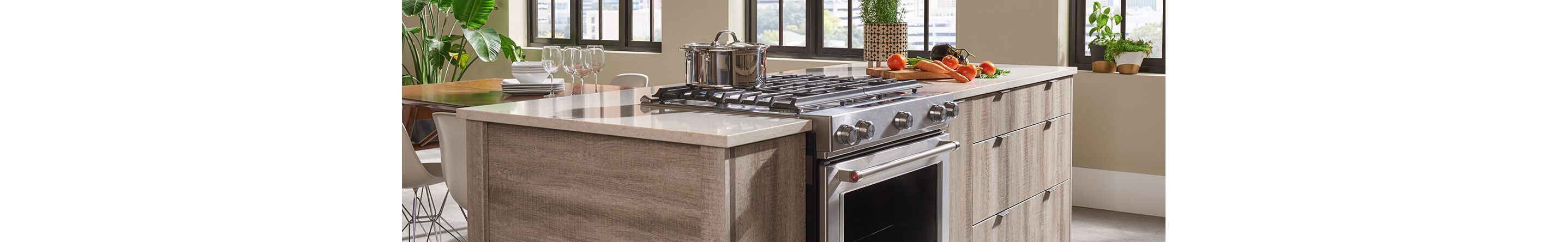Kitchen island with slide-in range