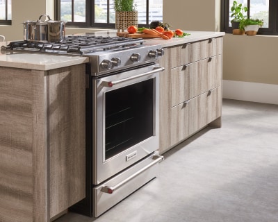 View of kitchen island and stove
