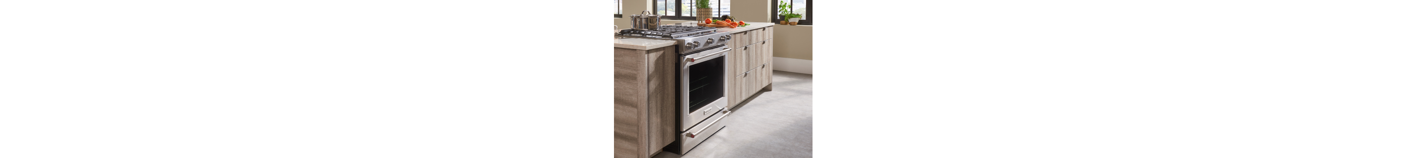 View of kitchen island and stove