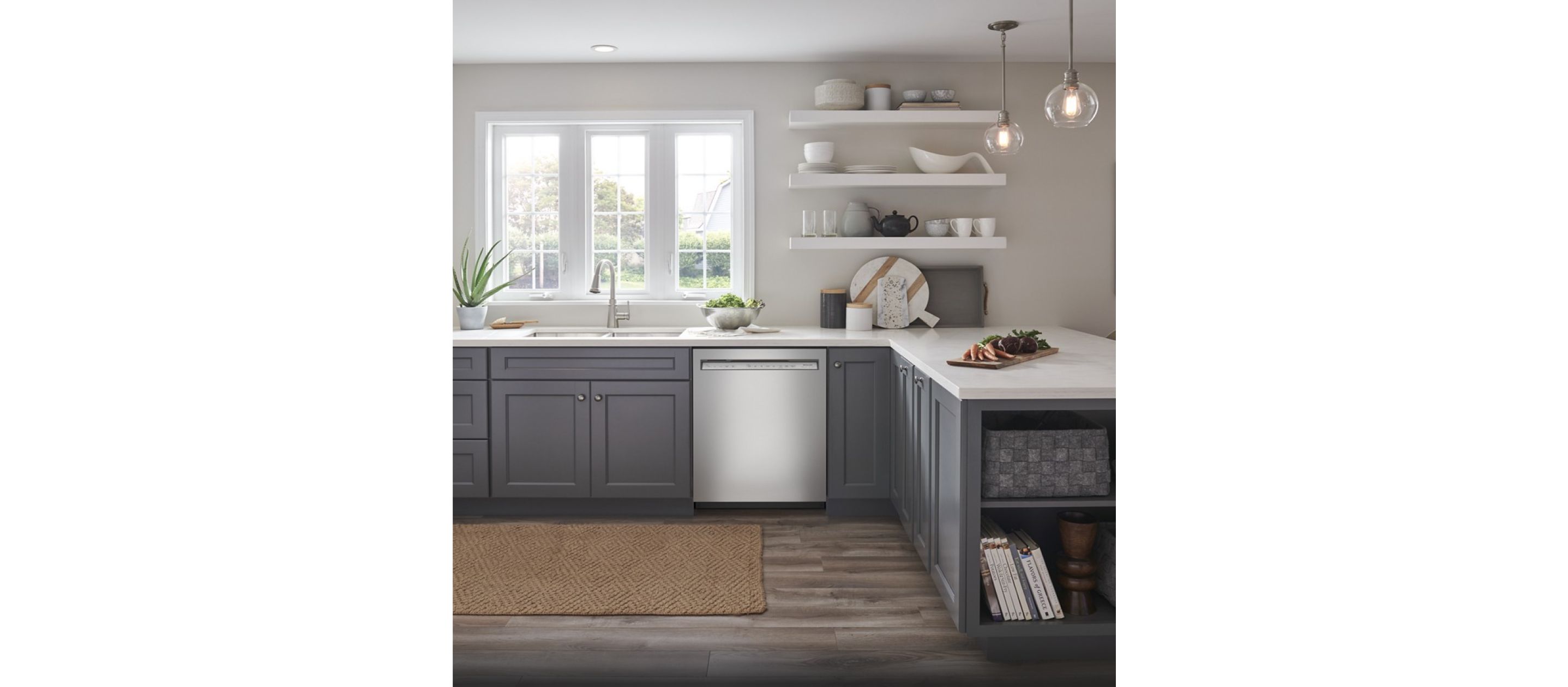 A bright, light kitchen with stainless steel appliances