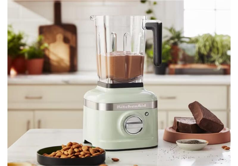 Blue K400 Blender with a smoothie bowl and fresh fruits next to it.