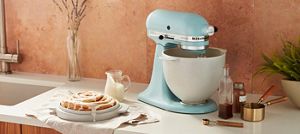 A Tilt-Head Stand Mixer with the Bread Bowl with Baking Lid.