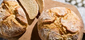 A loaf and slices of Boule bread.
