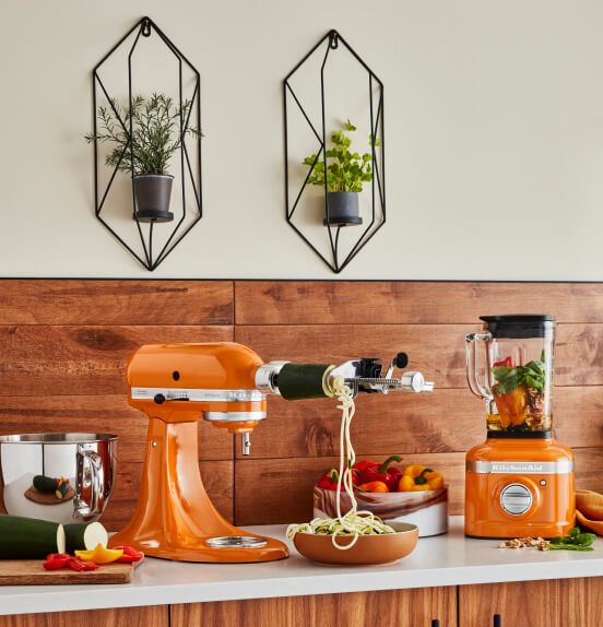 An Artisan® Series Stand Mixer in Honey making fresh zucchini noodles.