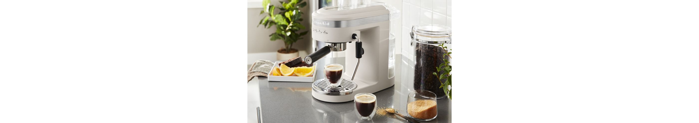 A Semi-Automatic Espresso Machine and Automatic Milk Frother Attachment.
