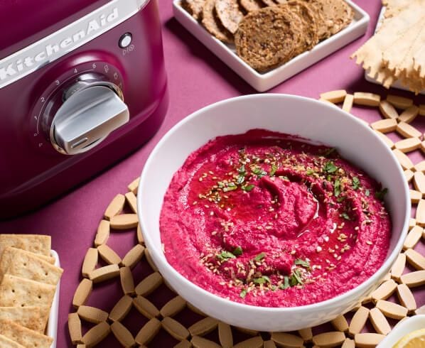 A bowl of beetroot hummus.