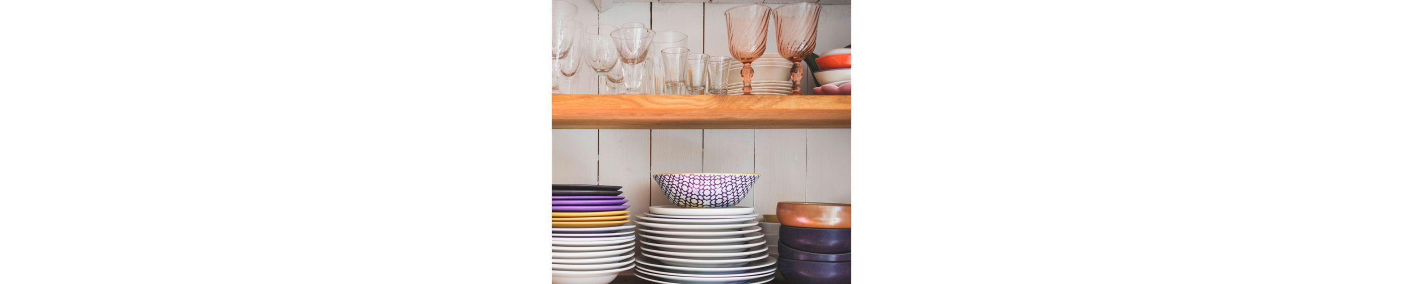 A variety of copper and purple dishes.