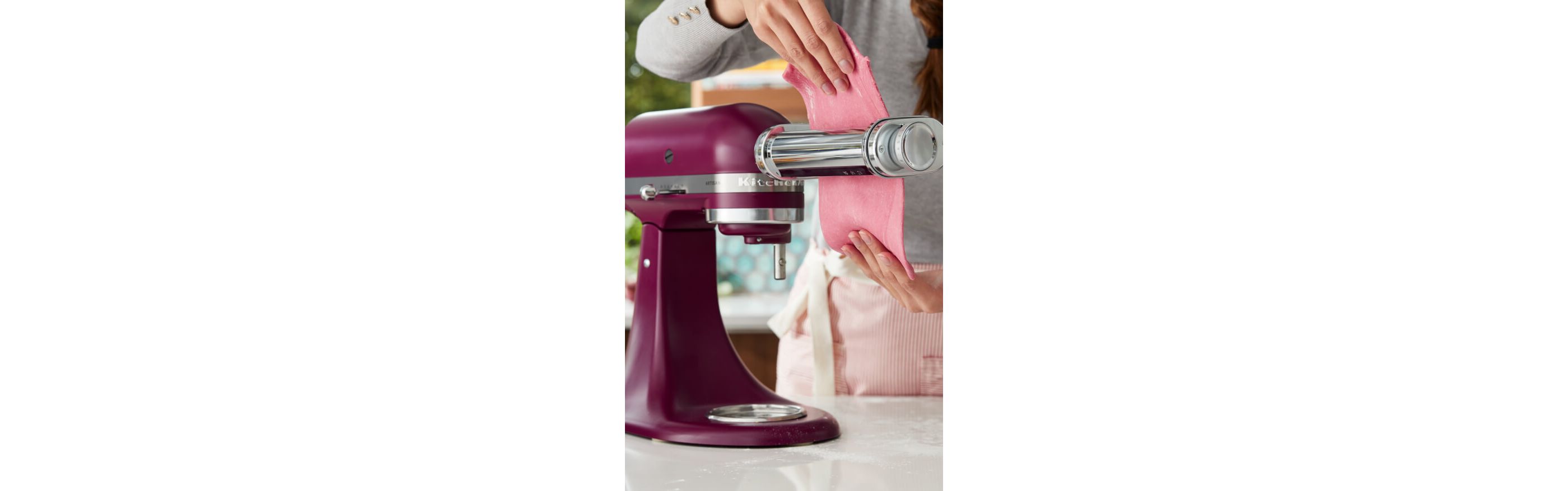 An Artisan® Series Stand Mixer in Beetroot making pasta.