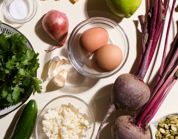Beetroots and other ingredients resting on a kitchen counter.