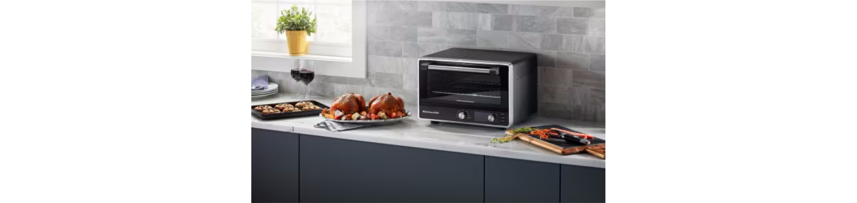 A KitchenAid® toaster oven on a countertop.