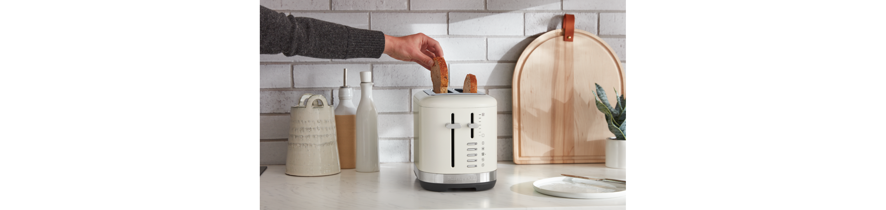 A KitchenAid® toaster with bagels inside.