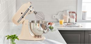 An Artisan® Stand Mixer resting on a kitchen counter.