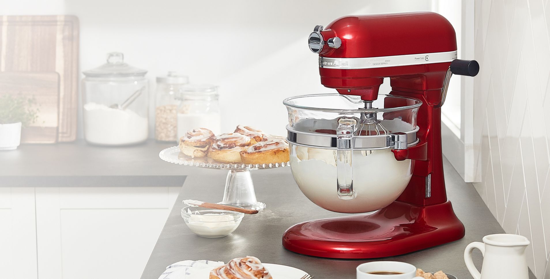 A KitchenAid® Stand Mixer side profile with baked goods
