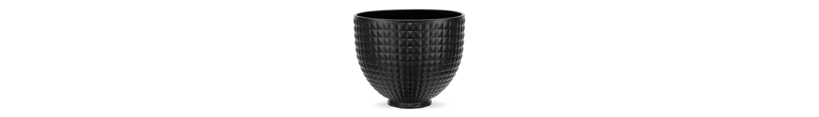 A studded black ceramic stand mixer bowl.