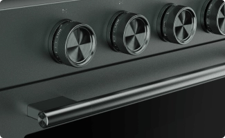 A close-up on the handle and knobs of a Juniper range.