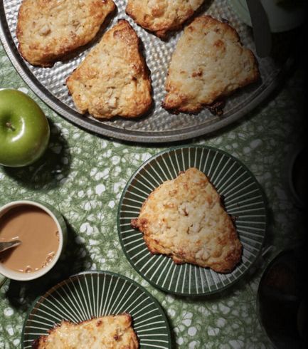 Freshly made apple pastries resting on delicate plates.