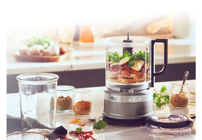 A Contour Silver 5 Cup Food Chopper filled with assorted vegetables.