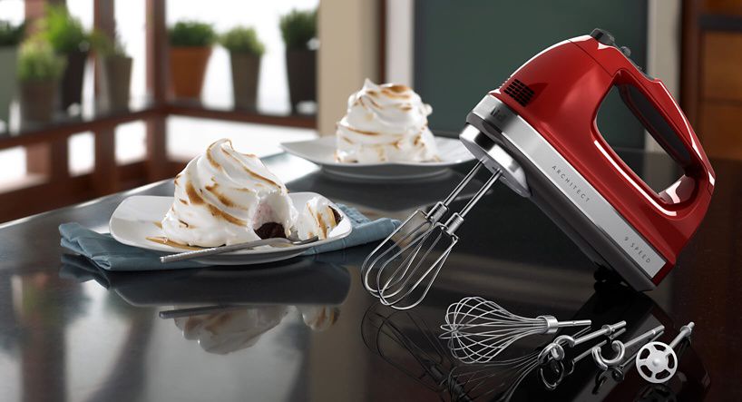 A 9-Speed Hand Mixer resting on a kitchen counter.