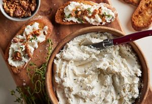 A bowl of goat cheese mousse crostini.