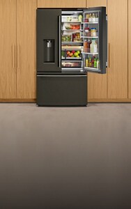 An open KitchenAid® refrigerator with design award badges