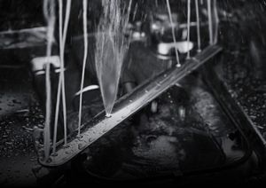 An in-depth shot of the FreeFlex™ Third Rack Dishwasher's lower rinsing jets in action.