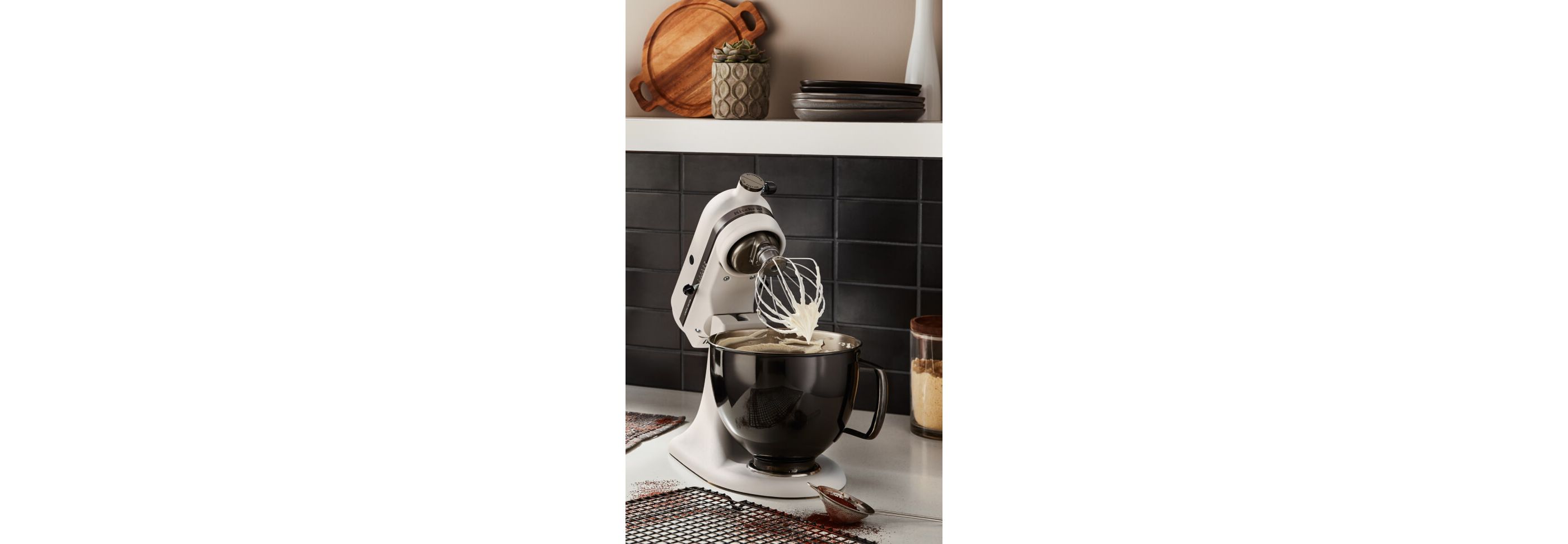 A Limited Edition Stand Mixer with Black Stainless Bowl whipping cream.
