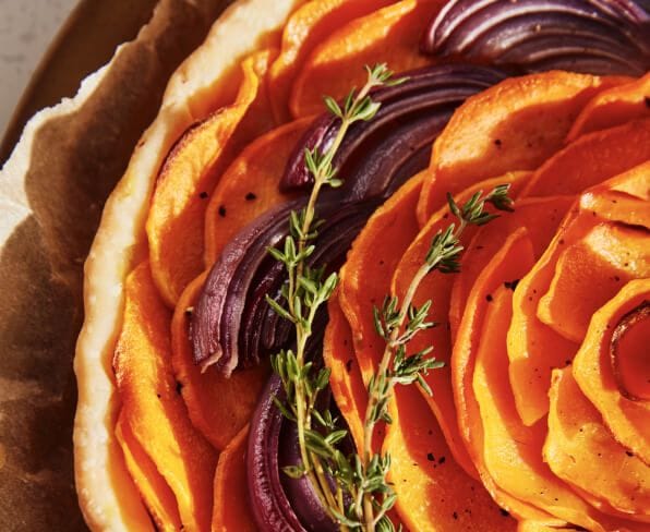 Sliced vegetables resting in a floral pattern.