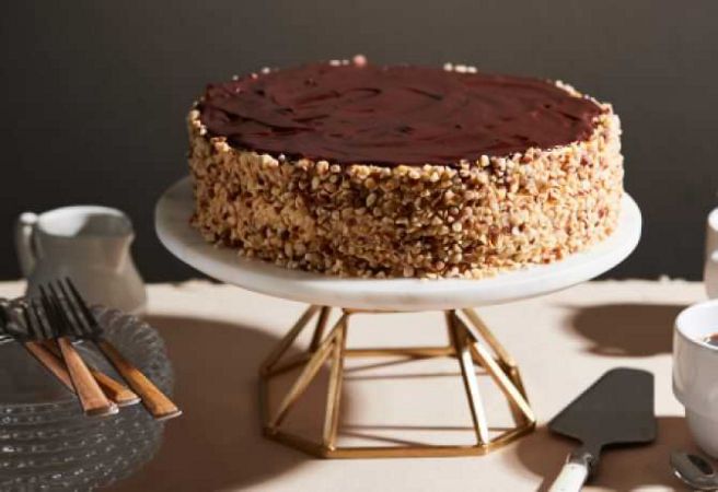 Boston Cream Pie placed on top of a serving platter.