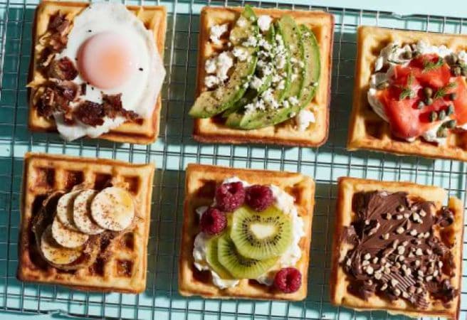 A cooling sheet with Mashed Potato Waffles placed on top.