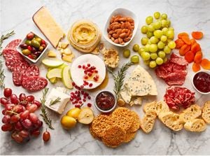 Charcuterie ingredients spread across a countertop.
