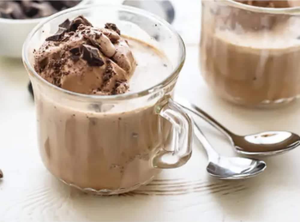 Chocolate ice cream in a mug with espresso poured over the top.