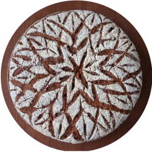 A royal flower design on baked bread.