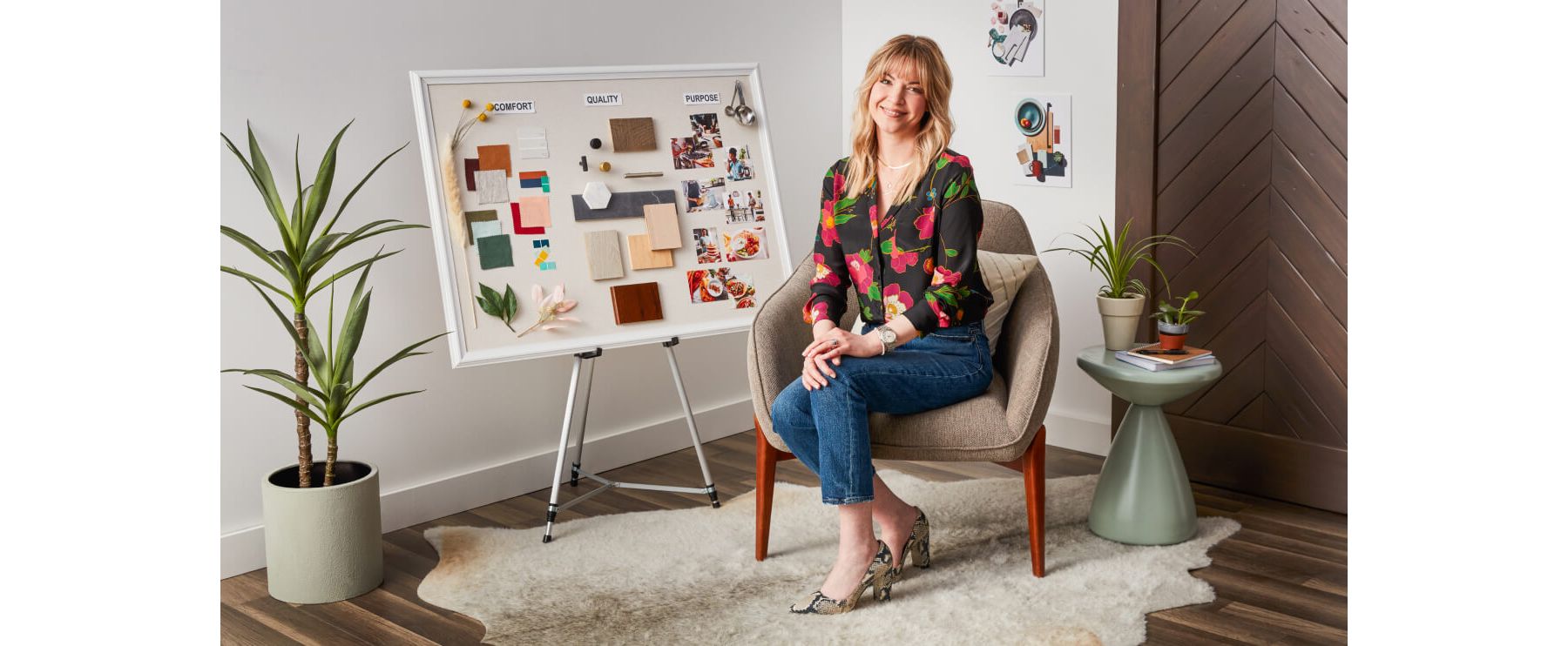 KitchenAid Designer Jessica McConnell in black floral top seated by inspiration board.