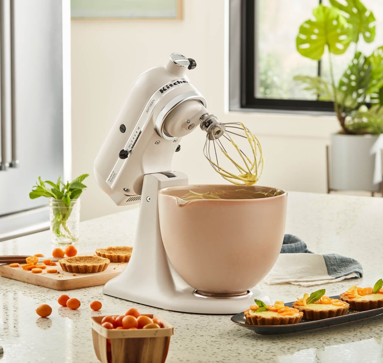 KitchenAid® Stand Mixer with whip attachment in Milkshake