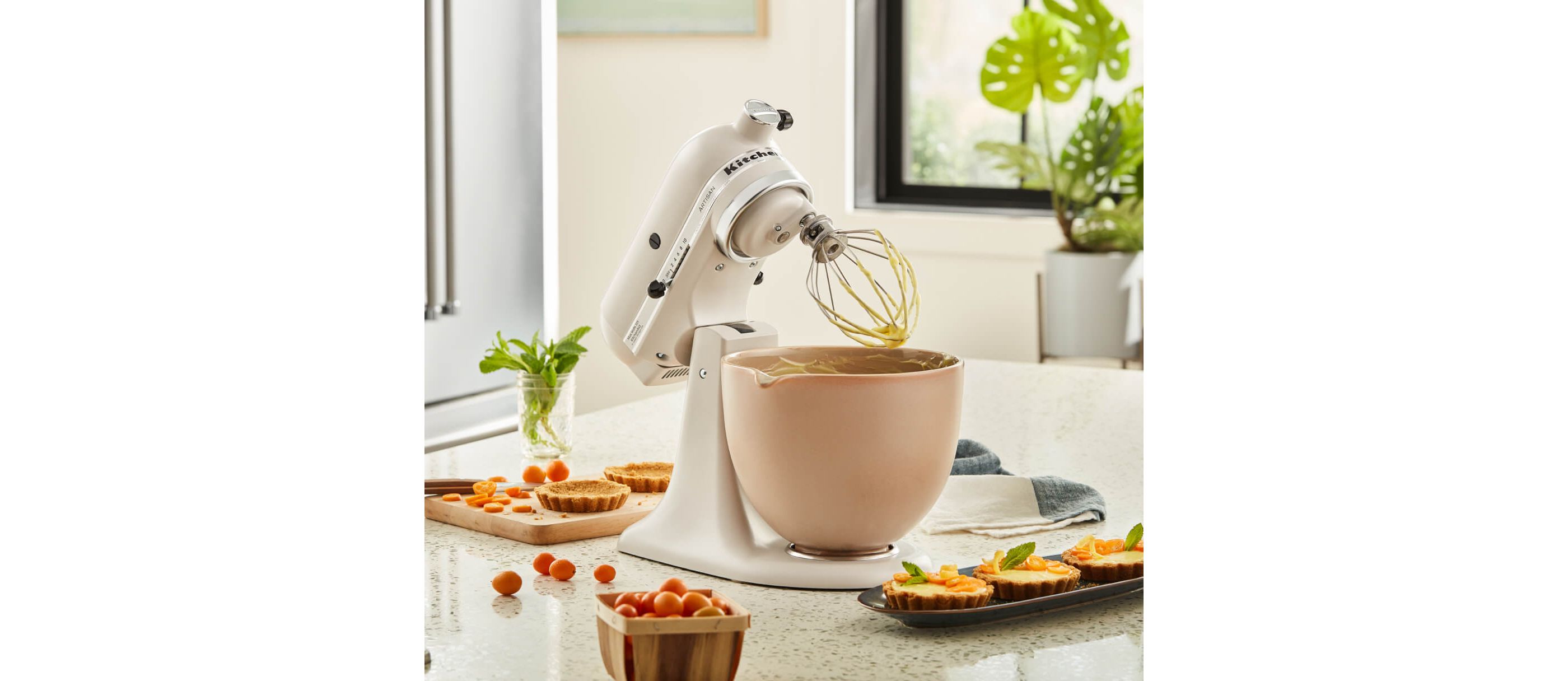 KitchenAid® Stand Mixer with whip attachment in Milkshake