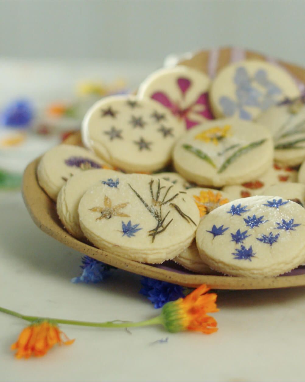 Freshly baked cookies with pressed flowers baked in.