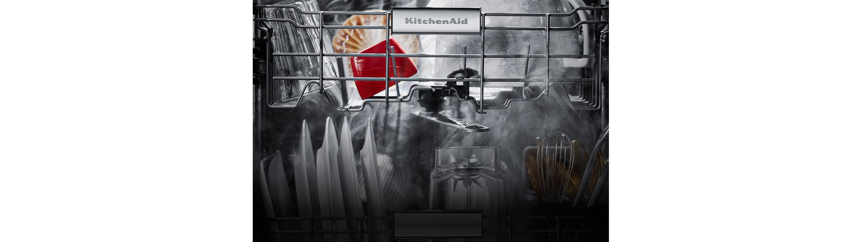 A close up of the loaded dishwasher.