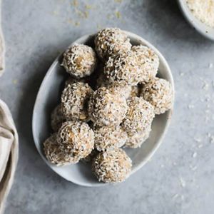 A white bowl filled with freshly made no bake energy bites.