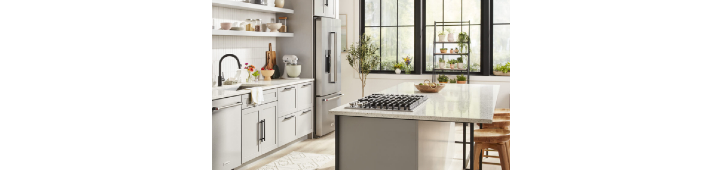 A white kitchen with KitchenAid appliances.