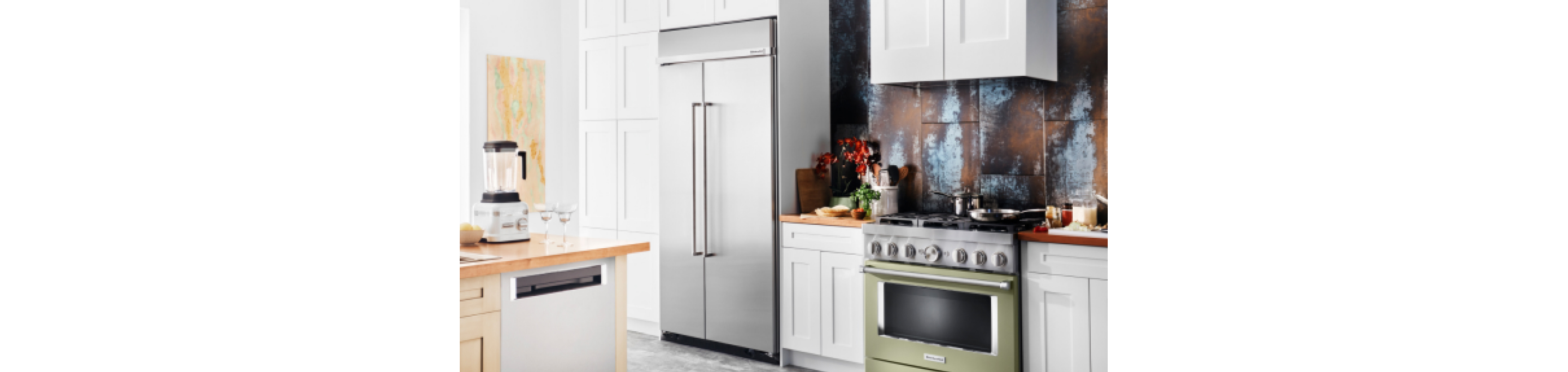 A kitchen featuring a refrigerator and range from KitchenAid.
