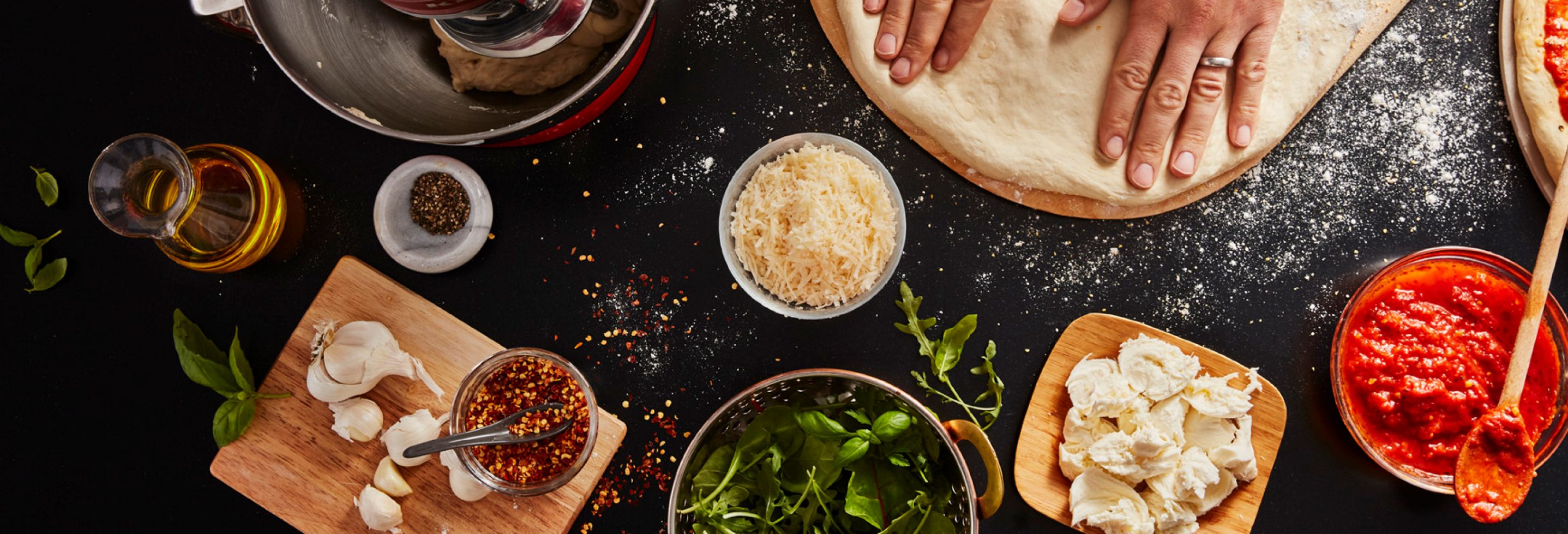 Preparing flatbread pizza with a KitchenAid® Stand Mixer.